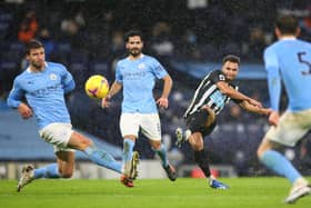 MANCHESTER, ENGLAND - DECEMBER 26:  Jacob Murphy of Newcastle United shoots during the Premier League match between Manchester City and Newcastle United at Etihad Stadium on December 26, 2020 in Manchester, England. The match will be played without fans, behind closed doors as a Covid-19 precaution. (Photo by James Gill - Danehouse/Getty Images)