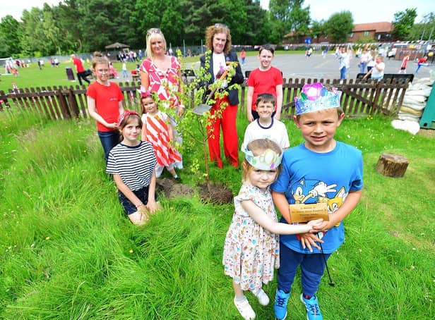 Lambton Primary School headteacher Amanda Defty (left) and Chair of Governors Linda Williams are given a helping hand from pupils Harriet, Harper, Shay, Piper, Ethan, Isla and Lennon as they plant a tree in the school grounds to celebrate the Queen's Platinum Jubilee. 

Picture by FRANk REID