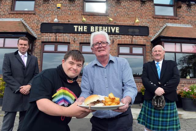 The Beehive pub will keep the traditional Houghton Feast roast ox sandwiches going in 2020. From left, Coun Kevin Johnston, assistant manager Logan Elliott, pub owner Jimmy Foley and Houghton Feast chair Kevin Reilly