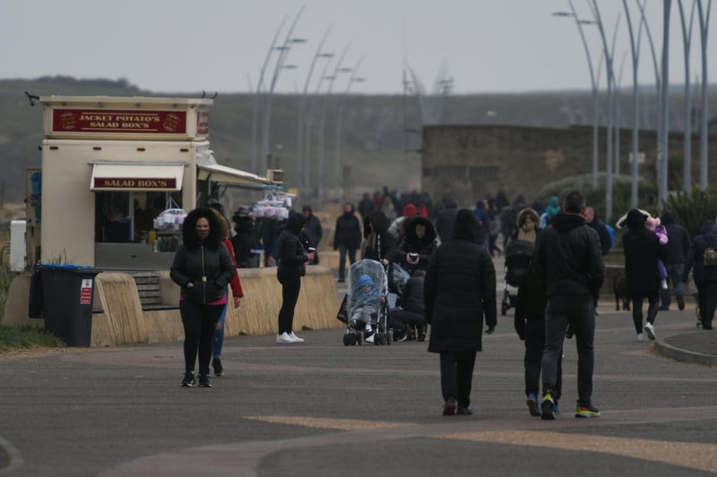 People still wrapped up against the cold on the promenade at South Shields on Monday.