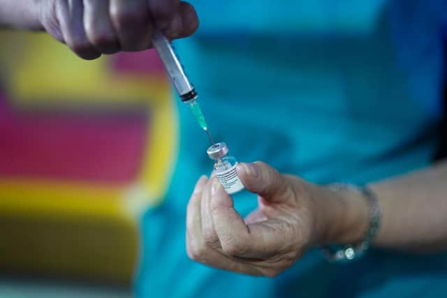 A doctor draws up the Pfizer-BioNTech vaccine. Picture: Ian Forsyth/Getty Images