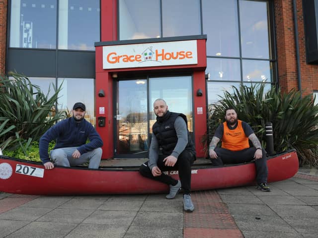 Shaun Armbruster, 32, Ryan Gallagher, 34, and Danny Bell, 28, with their canoe, which they will carry whilst running Hadrian's Wall to raise money for Grace House.