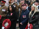 Carla and Tom Cuthbertson (centre) wait to lay their wreath