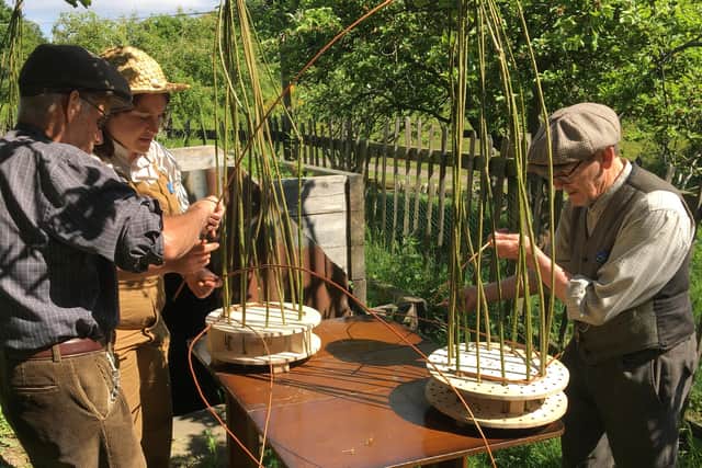 Participants taking part in an activity in the garden.