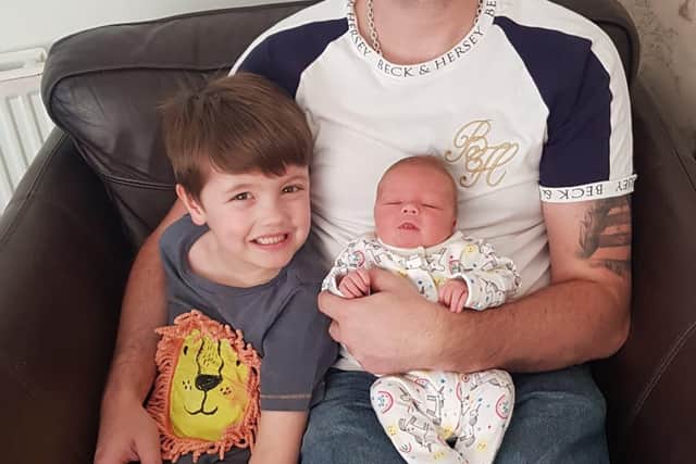 Dad Trevor Robson with son Jonathon and baby Sophia.