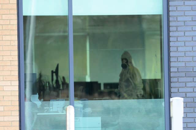 Image of a person in white coveralls Nike office Doxford Park, Sunderland. Picture by FRANK REID
