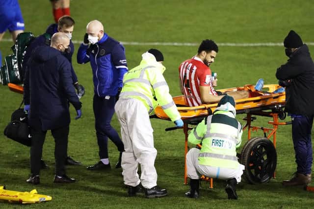 Jordan Willis of Sunderland is stretchered off the pitch after sustaining an injury during the Sky Bet League One match between Shrewsbury Town and Sunderland at Montgomery Waters Meadow on February 09, 2021 in Shrewsbury. (Photo by Naomi Baker/Getty Images)