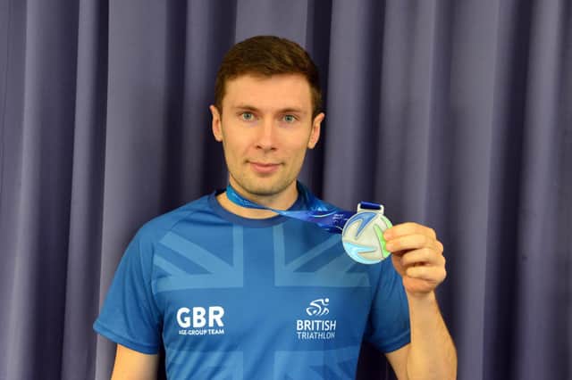 Seaburn Dene Primary School teacher James Ashton with his medal for competing in World Triathlon Championships in Abu Dhabi.