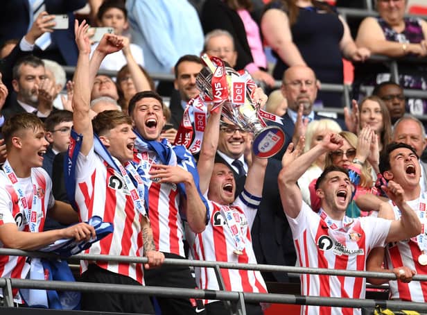 LONDON, ENGLAND - MAY 21: Corry Evans of Sunderland lifts the Sky Bet League One Play-Off trophy following victory in the Sky Bet League One Play-Off Final match between Sunderland and Wycombe Wanderers at Wembley Stadium on May 21, 2022 in London, England. (Photo by Justin Setterfield/Getty Images)
