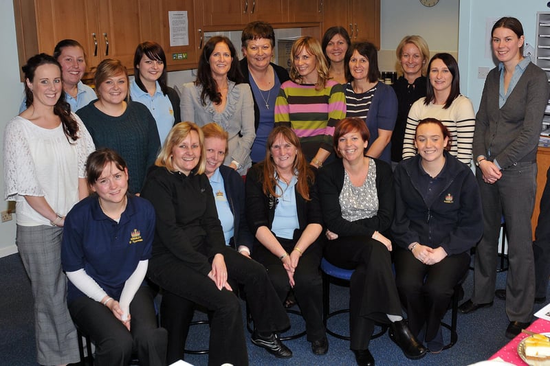 Kingsley Primary School dinner lady Linda Harvey (front centre) with school staff in 2012. Who can tell us more?