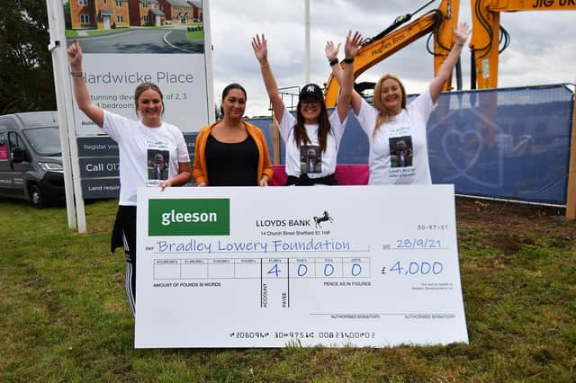 Gemma Lowery (2nd left) is presented with a cheque for £4.000 by Bradley Lowery foundation walkers (left to right) Natalie Bailey, Terri and Gemma Sowerby.