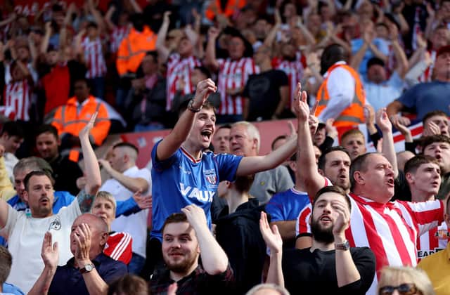 STOKE ON TRENT, ENGLAND - AUGUST 20: Sunderland fans celebrate after their team score the first goal during the Sky Bet Championship between Stoke City and Sunderland at Bet365 Stadium on August 20, 2022 in Stoke on Trent, England. (Photo by Clive Brunskill/Getty Images)