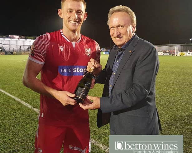 Former Scarborough FC boss Neil Warnock, right, presents the Betton Wines Man of the Match award to Athletic's Ash Jackson after the 2-2 draw with Bradford PA
