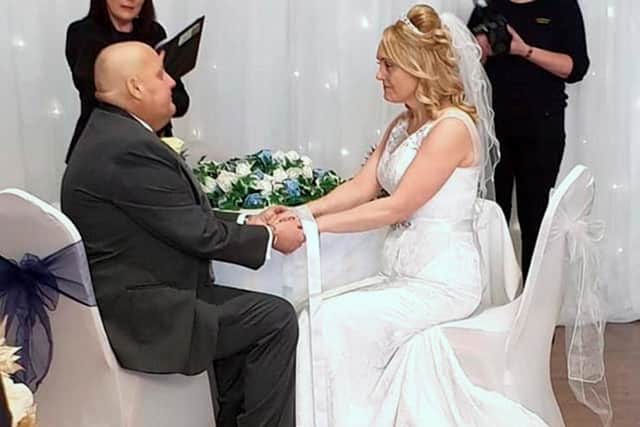 Terminal cancer patient Chris Clark, 43, who hosted his own wake last month to say goodbye to friends and family, and has now fulfilled his dying wish by marrying his "rock", partner Claire, 46, in a registry office ceremony in South Shields.