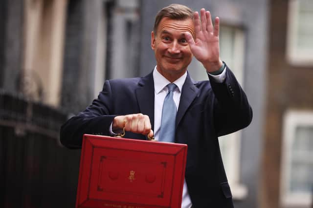 Chancellor Jeremy Hunt leaves Downing Street to present his spring budget which includes widening free childcare provision for children under three.

Photograph: Dan Kitwood/Getty Images