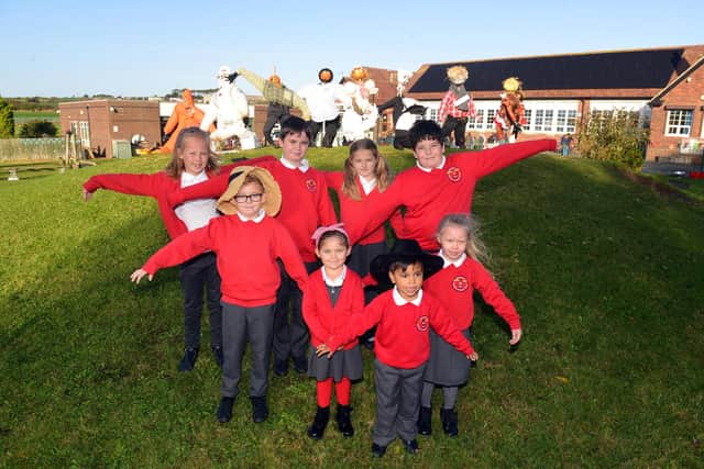 Marsden Primary School children with their scarecrow designs.
