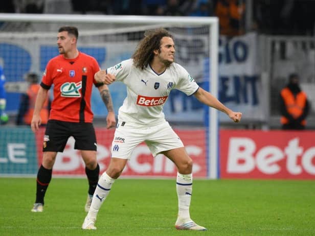 Marseille's French midfielder Matteo Guendouzi (R) celebrates after winning the French Cup round of 32 football match between Olympique de Marseille (OM) and Stade Rennais FC at the Stade Velodrome in Marseille, southern France on January 20, 2023. (Photo by Nicolas TUCAT / AFP) (Photo by NICOLAS TUCAT/AFP via Getty Images)
