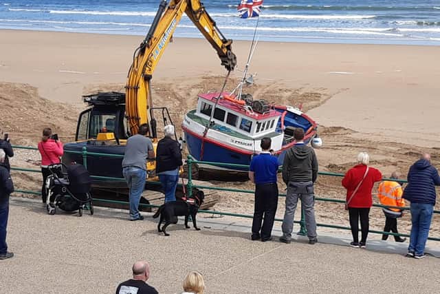 People watched on as work was carried out to try and rescue Pelican during Wednesday afternoon.
