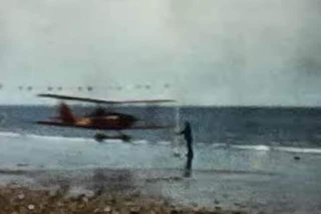 An astonishing scene as a plane flies past people on the beach in this footage from Bob Wingate.