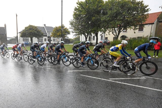 Tour of Britain leaders ride throught torrentail rain at Newbottle on their way to a Sunderland town centre finish.
