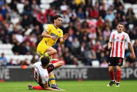 Sunderland defender Tom Flanagan goes in for a tackle against AFC Wimbledon.
