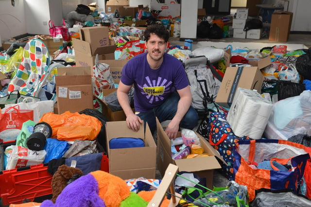 Geek Retreat owner Stewart Brass was surrounded by donated items from local schools and colleges, all destined for refugees from Ukraine in March last year.