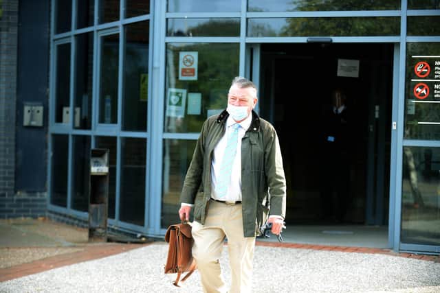 Former councillor Jeff Milburn leaving court.