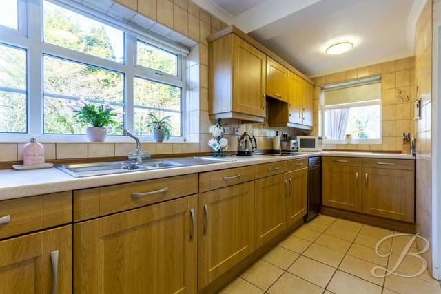 The kitchen has a rustic feel to it. It comes complete with a range of units and cabinets, plus lots of worktop space to prepare meals.