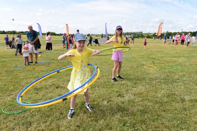 Eve and Megan Anderson, eight and 10, hula hooping at Herrington Country Park.
