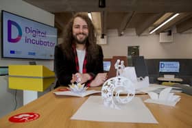 MA Design student David Green with some of his original pop-up toy designs. 

Photograph: David Wood