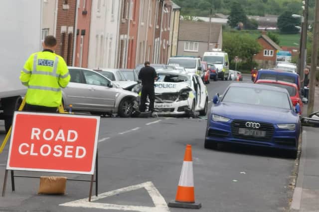 The scene following the crash, in which two officers were taken to hospital. Photo: John Ball.