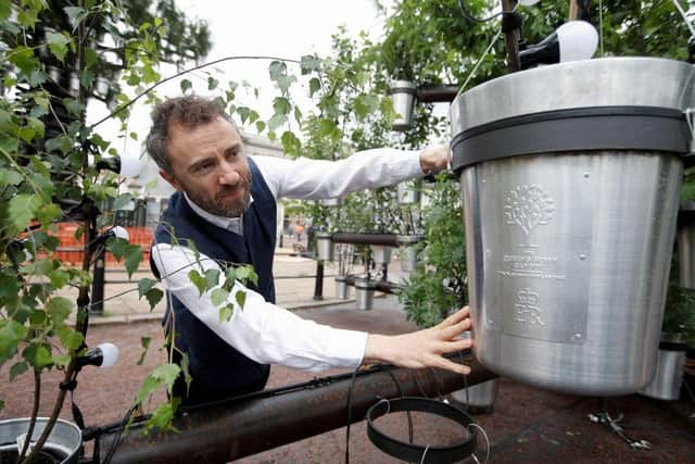 Designer Thomas Heatherwick, with one of the specially created pots