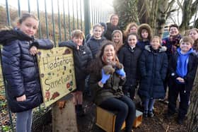 Ecologist Julie Dyson with Huffy and Jimmy the hedgehogs and pupils from St Mary's Primary School at the school's new hedgehog sanctuary.