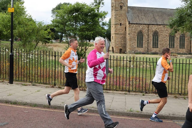 Keith Weavers running with the baton.