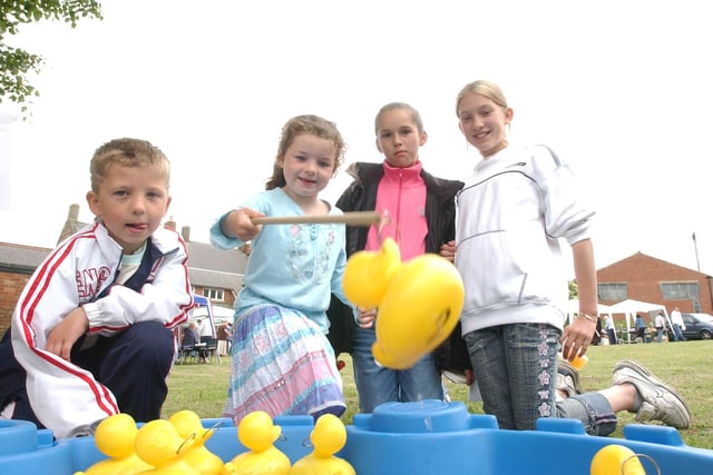 Back to 2006 where these children were having fun during a hook-a-duck session at St Oswald's Church fun day.