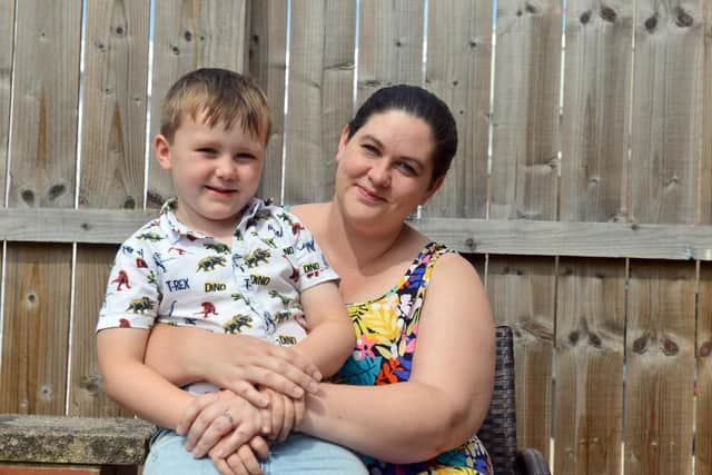 Kimberley Allison with her son Logan, five, who saved her when she slipped into the River Wear. Image, Sunderland Echo.