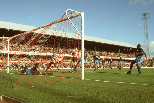 Paul Stewart (right) wheels away to celebrate his winning goal against Aston Villa, to the relief of David Kelly (left) whose penalty was saved.