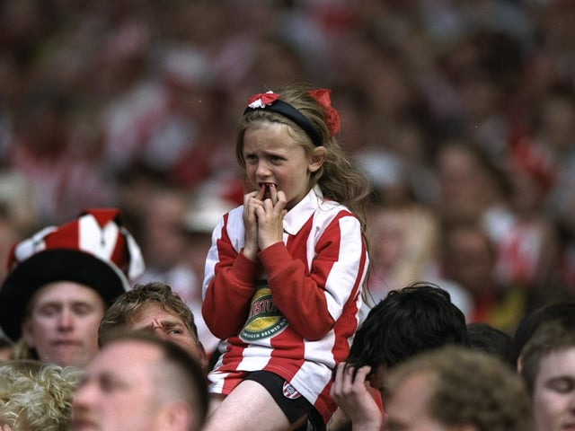 A young Sunderland fan watches the Division One play-off final against Charlton Athletic at Wembley Stadium in London. The match ended in a 4-4 draw after extra time and Charlton Athletic went on to win 7-6 on penalties in 1997.