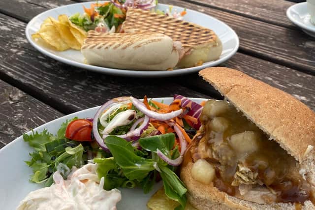 Pork, stuffing and apple roll, front, and cheese and ham panini, back