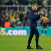 Newcastle United head coach Eddie Howe applauds fans at the final whistle.