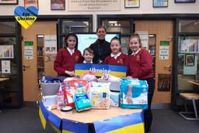 Pupils Sebastian Davey, 10, Izabella Wiseman, 11,  Amelia Rogerson, 11, and Eden Bleek, 11, with headteacher Ashleigh Sheridan and some of the donated items.