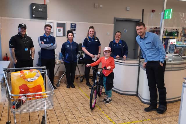 Kasie Williams, seven, had her bike stolen from Aldi on St Mark's Road, so staff there chipped in to buy her a new one.