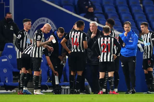Steve Bruce, Manager of Newcastle United talks to Isaac Hayden and teammates during the Premier League match between Brighton & Hove Albion and Newcastle United at American Express Community Stadium on March 20, 2021 in Brighton, England.