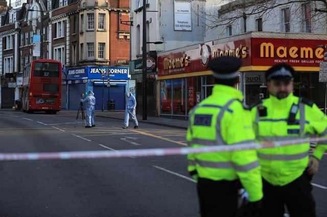 Forensic officers at the scene on Monday, February 3, following the terror attack in Streatham High Road. Picture: PA.