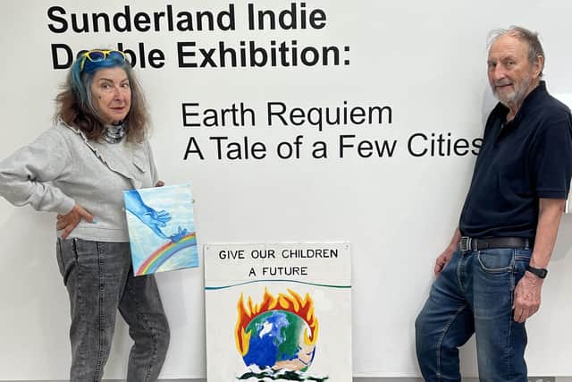 Artist Dolores Porretta-Brown holds one of her contributions to the Earth Requiem, next to Sunderland Indie founder Barrie West.