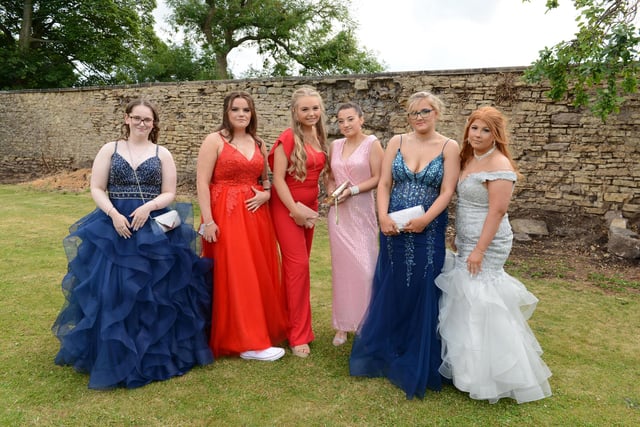 Year 11 students in a range of prom dresses.