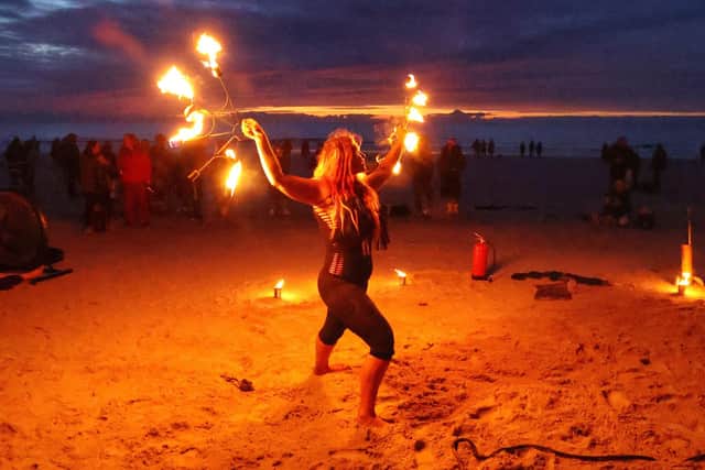 Pre-dip entertainment from fire eater Penella Bee.

Photograph: North News and Pictures NNP