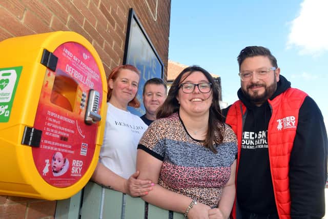 The family with the defibrillator installed at The Cliff