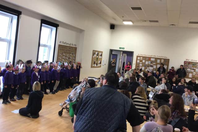 Children at Marlborough Primary School performing for guests at the Easter coffee morning.