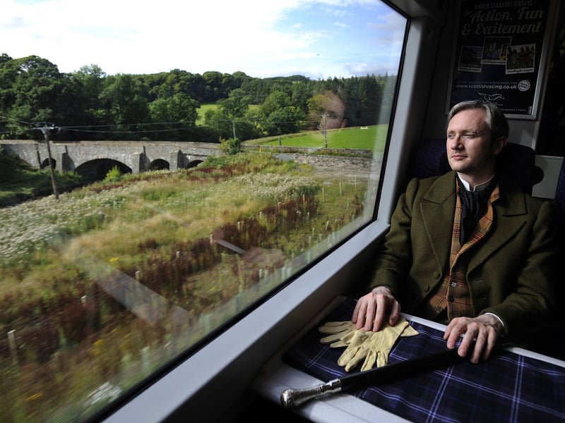 A passenger enjoys views from the Borders Railway travelling through Tweedbank.